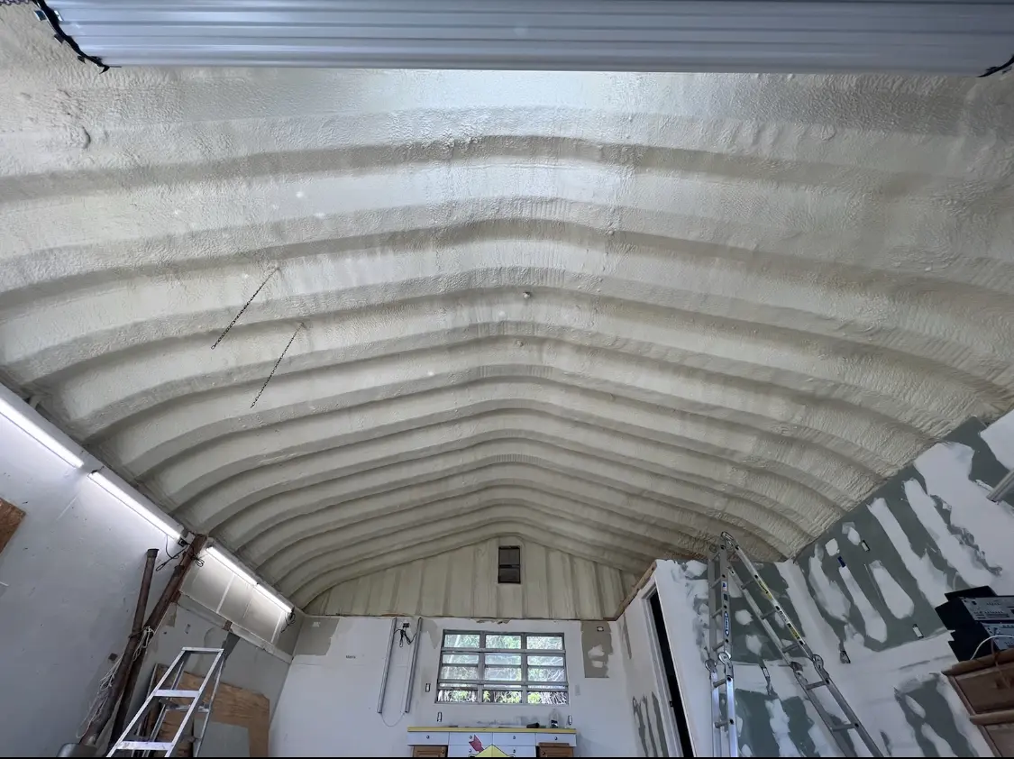 Spray polyurethane foam applied to the underside of a metal roof deck in Briar Chapel
